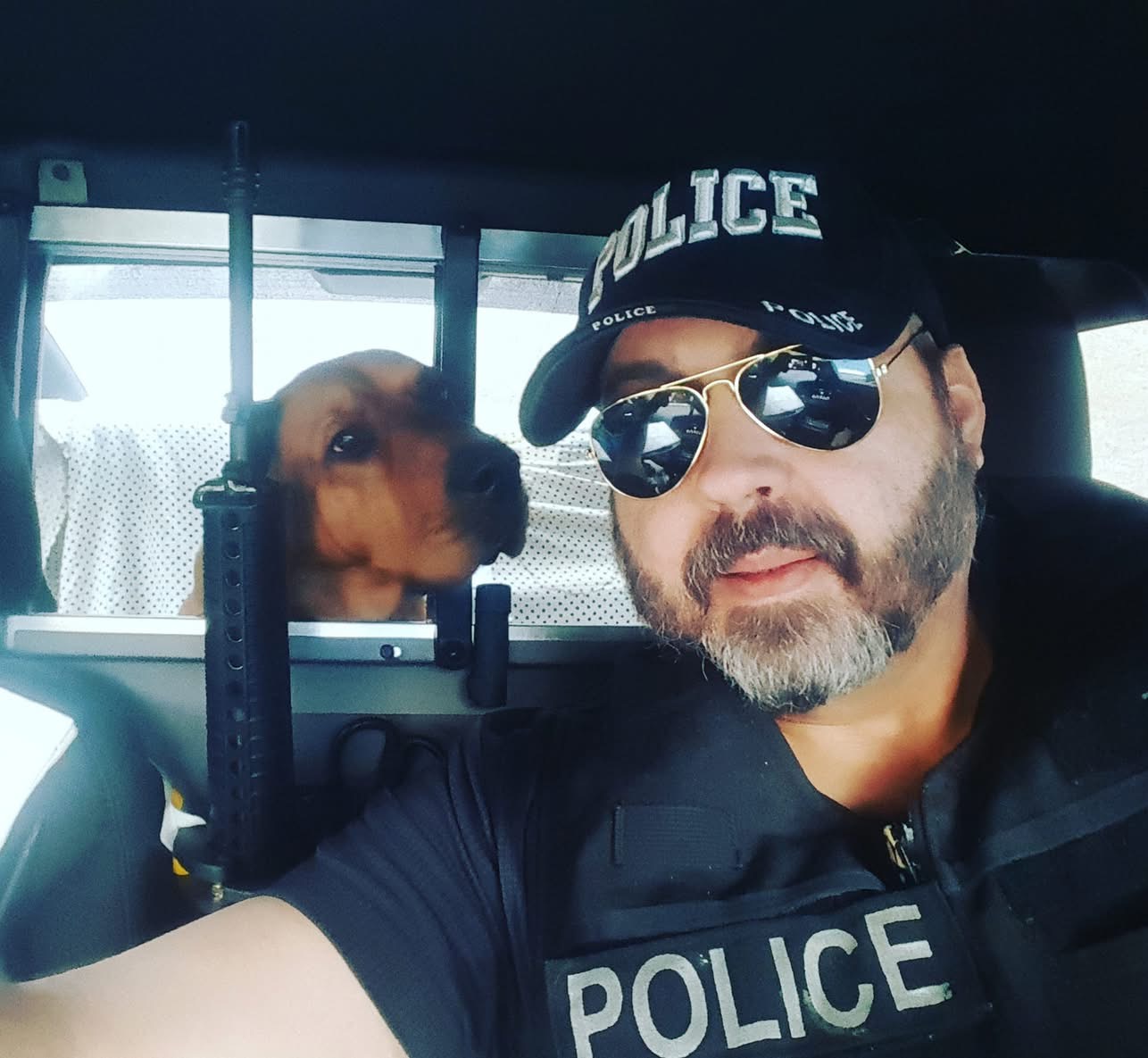Shannon L. Salley with RIP, his search and rescue police bloodhound